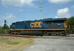 CSX 5492 leads train Q491 across Evans Street after leaving the yard